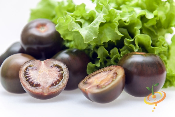 Black cherry indeterminate tomato seeds from SeedsNow, showing small, dark-colored cherry tomato seeds on a white background.